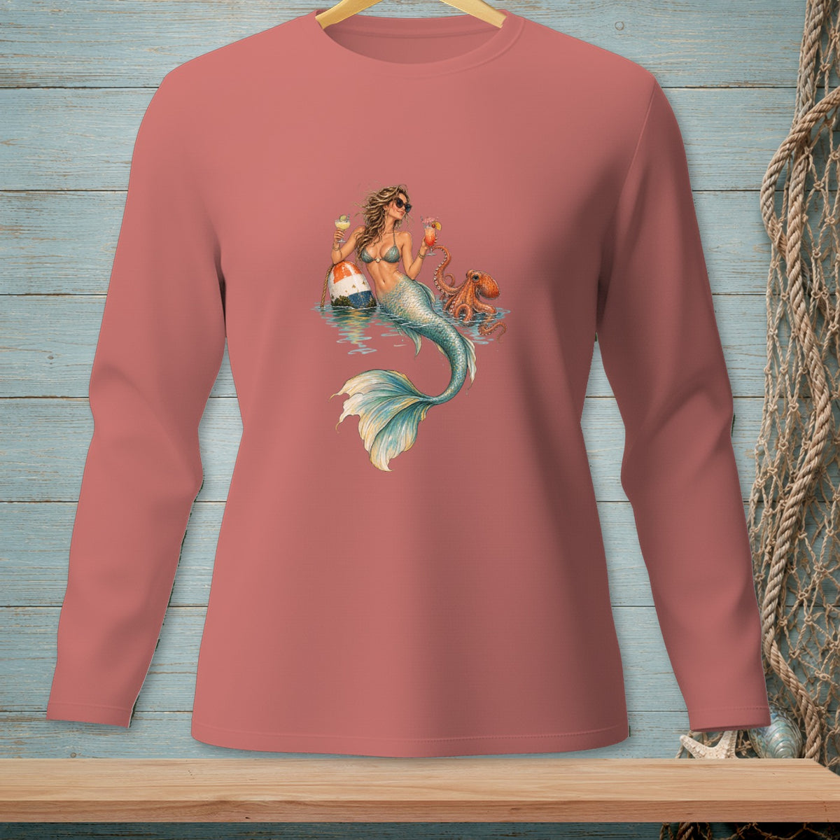 Long sleeve shirt with a mermaid, octopus, and drinks graphic on the front.