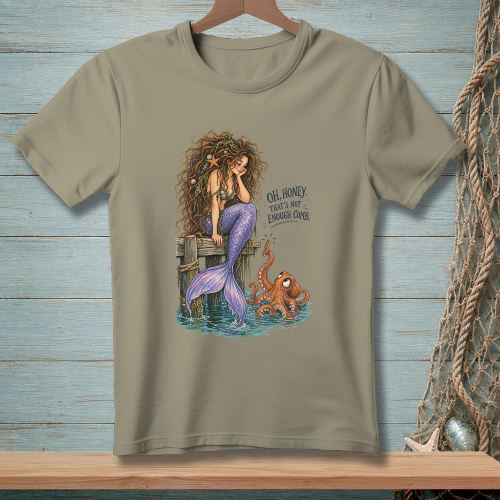 Mermaid with tangled hair sits on a dock next to an octopus and text that says "OH, HONEY. THAT'S NOT ENOUGH COMB."