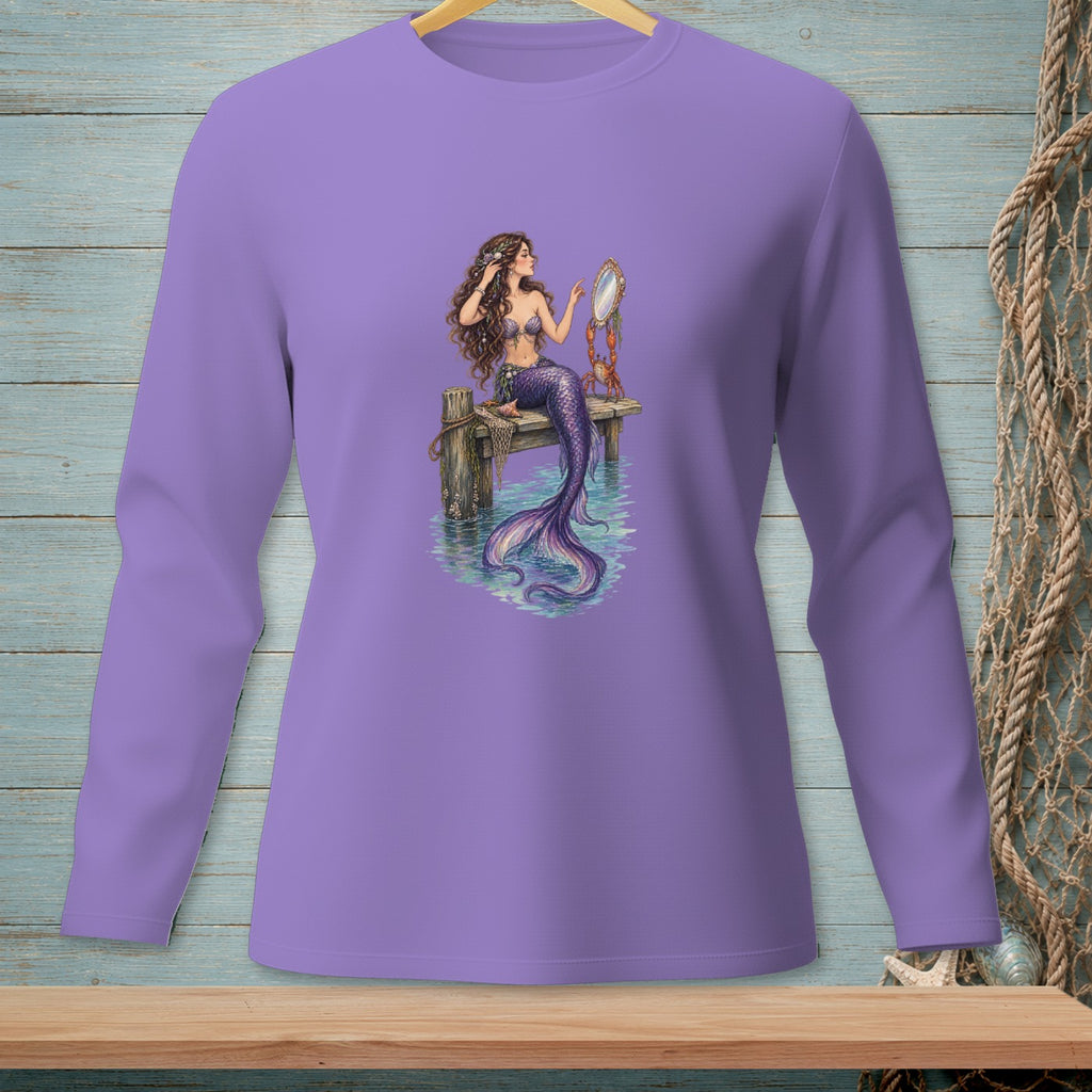 Mermaid sitting on a pier, holding a mirror, with a crab on a purple long-sleeve shirt.