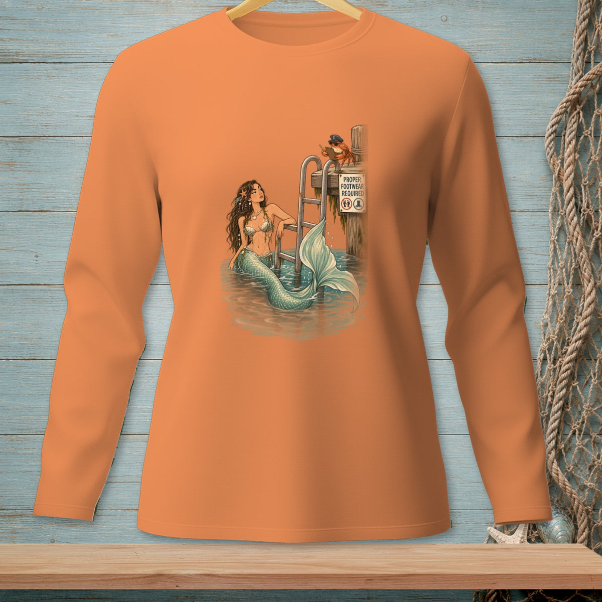 Mermaid on dock ladder with crab sign, "Proper Footwear Required."