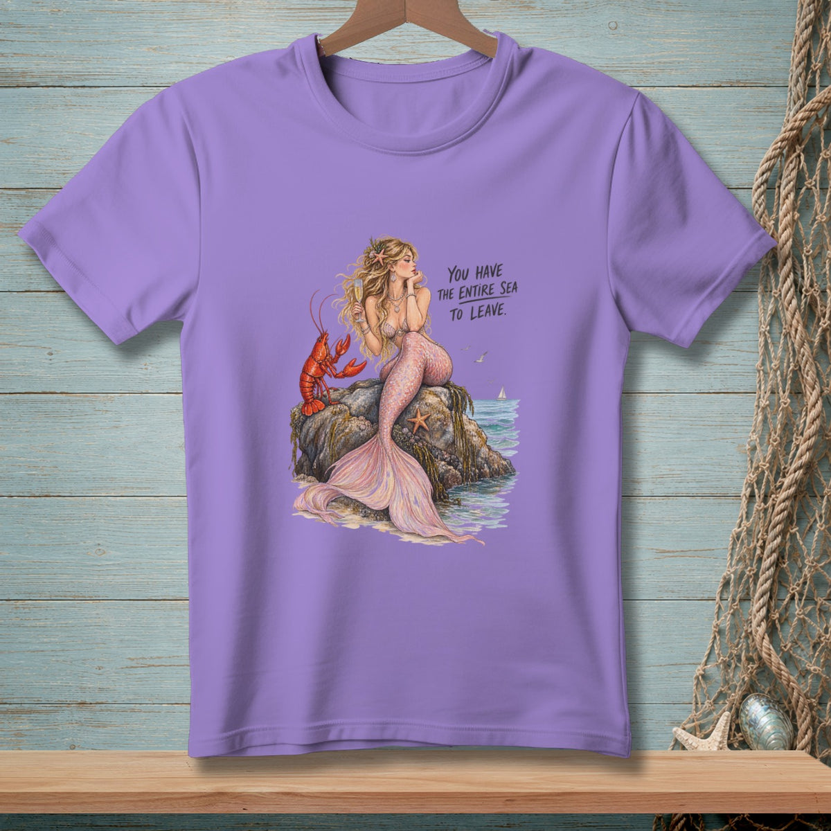 Purple t-shirt with a mermaid, lobster, and text: "You have the entire sea to leave."