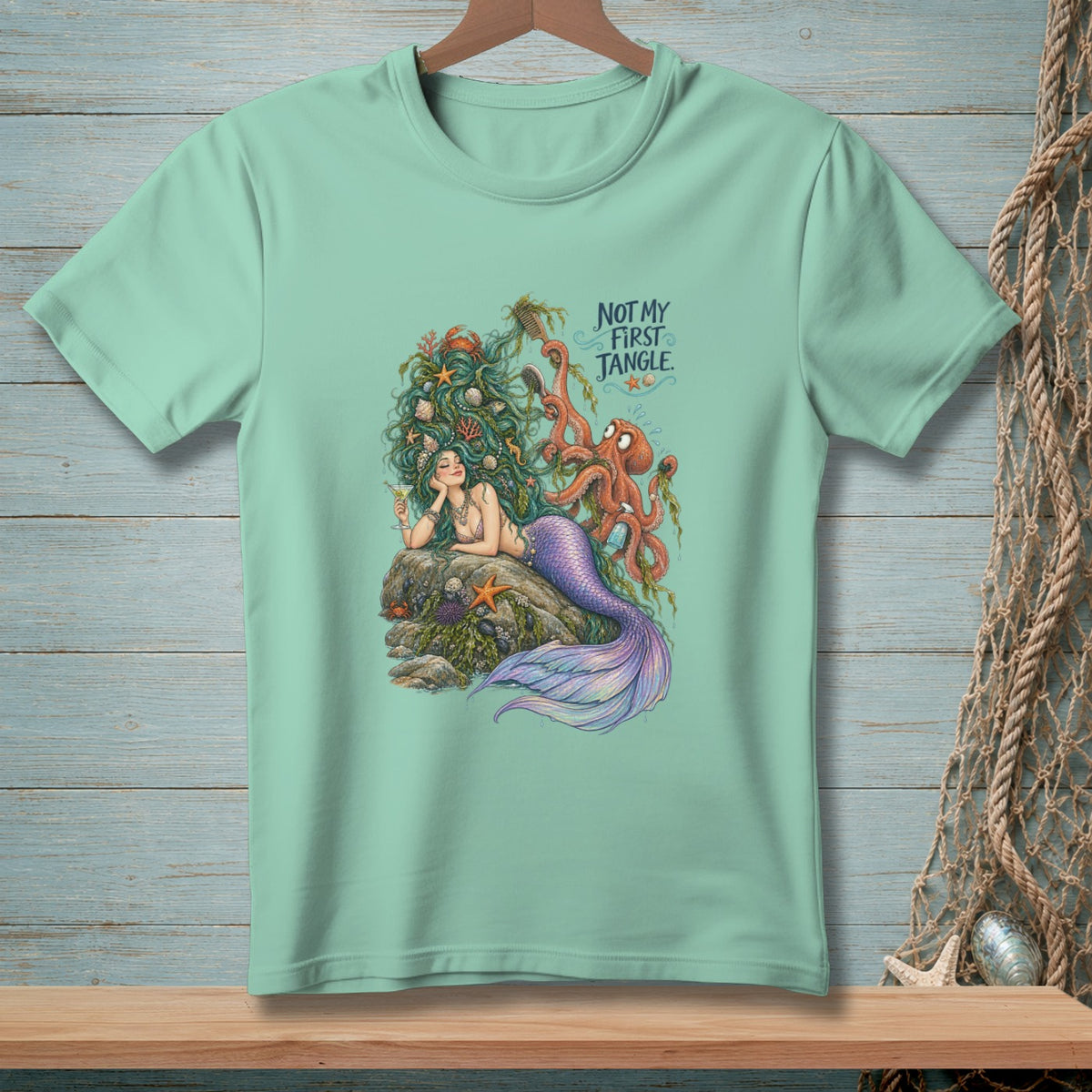 Mint t-shirt with mermaid, octopus, and text "NOT MY FIRST JANGLE."
