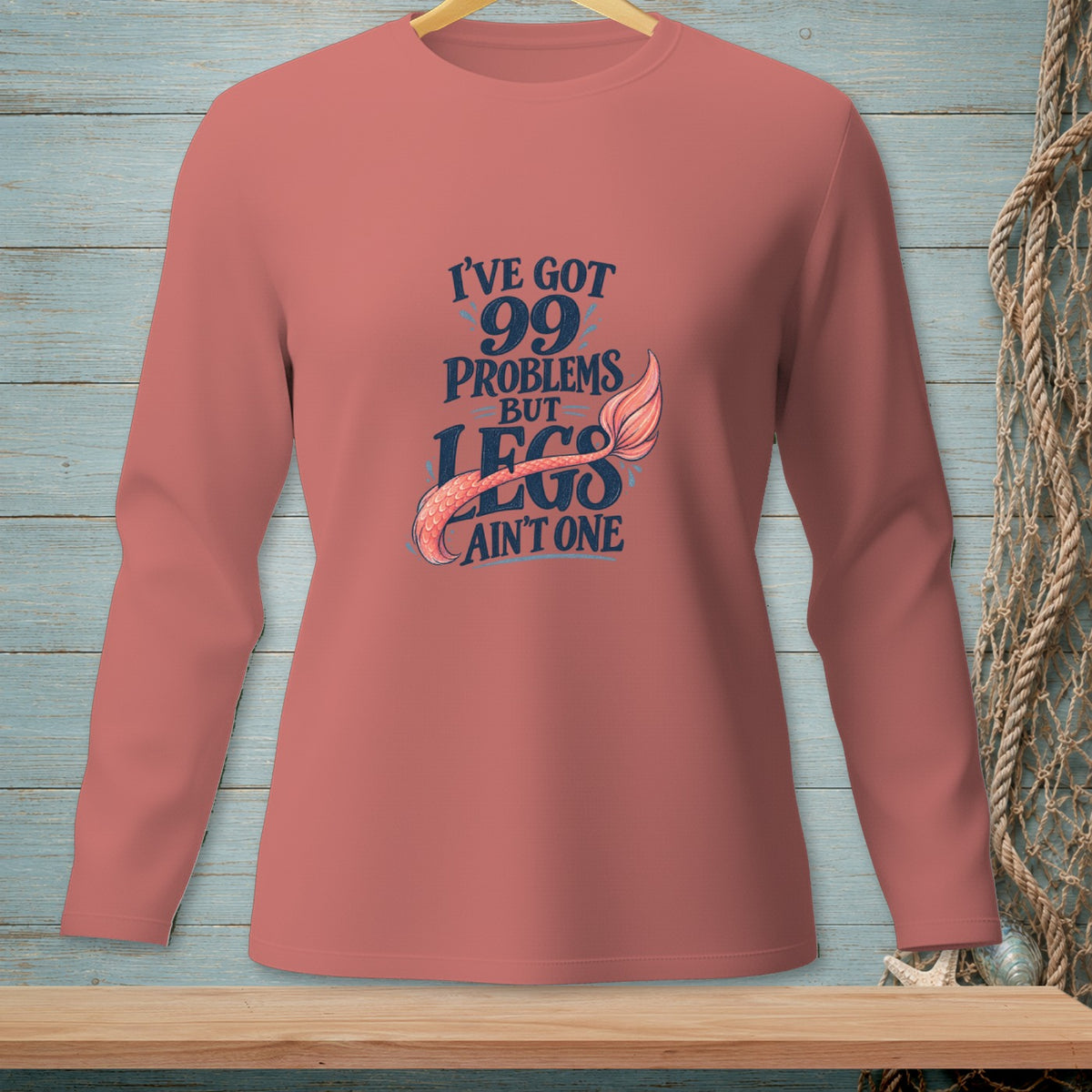 Coral long sleeve shirt with "I've got 99 problems but legs ain't one" text.