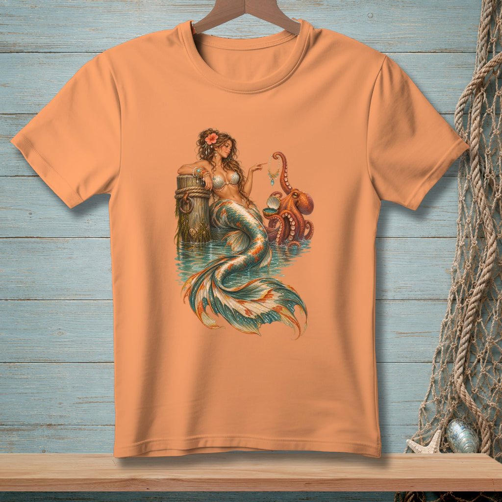 Mermaid and octopus illustration on an orange t-shirt.