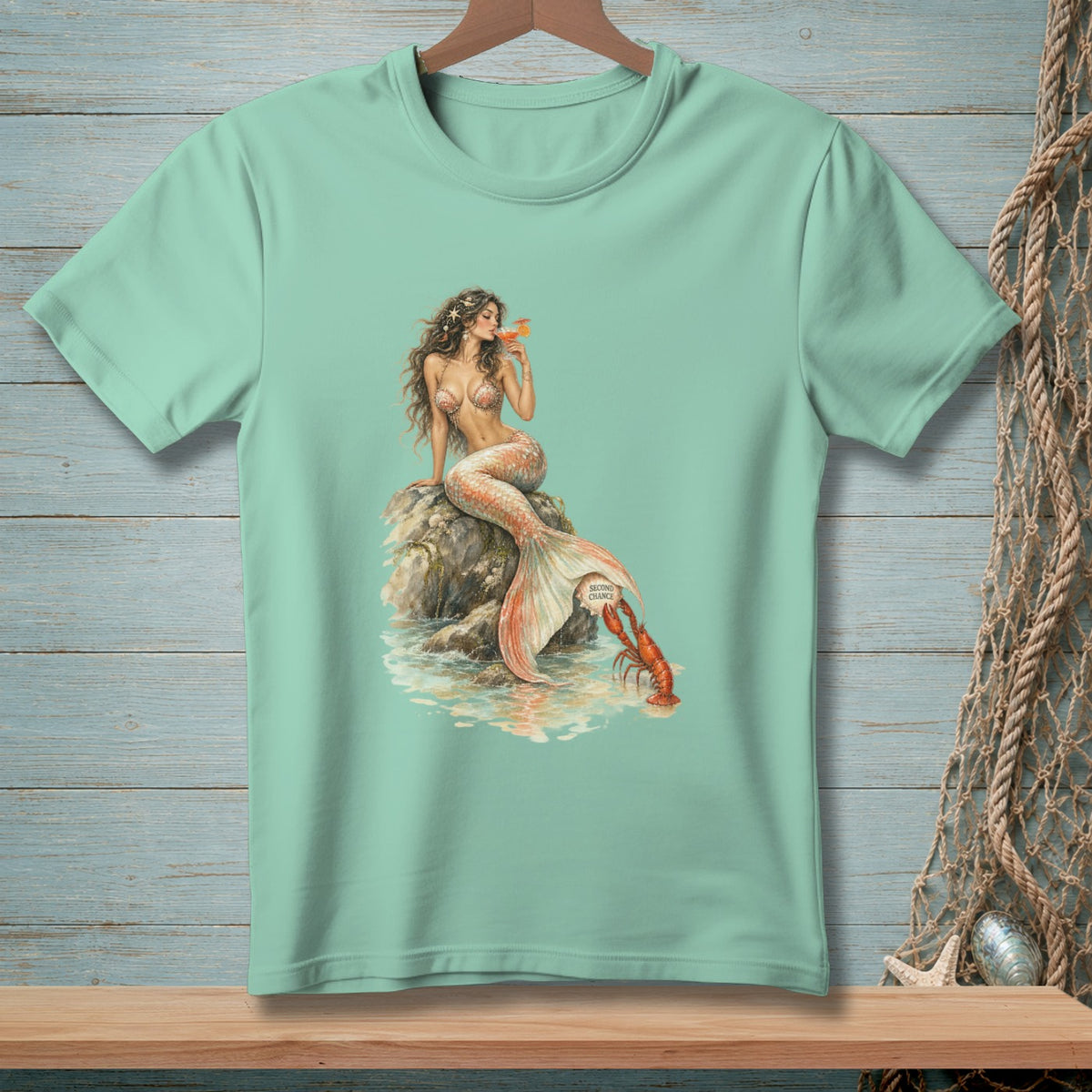 Mermaid with orange drink and lobster by a rock, text "Second Chance".