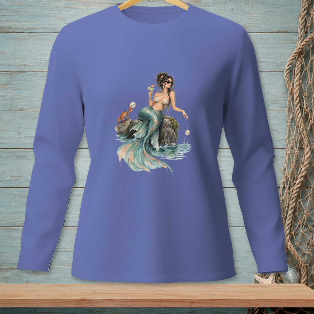 Long-sleeve shirt with a mermaid graphic holding a drink on a rock.