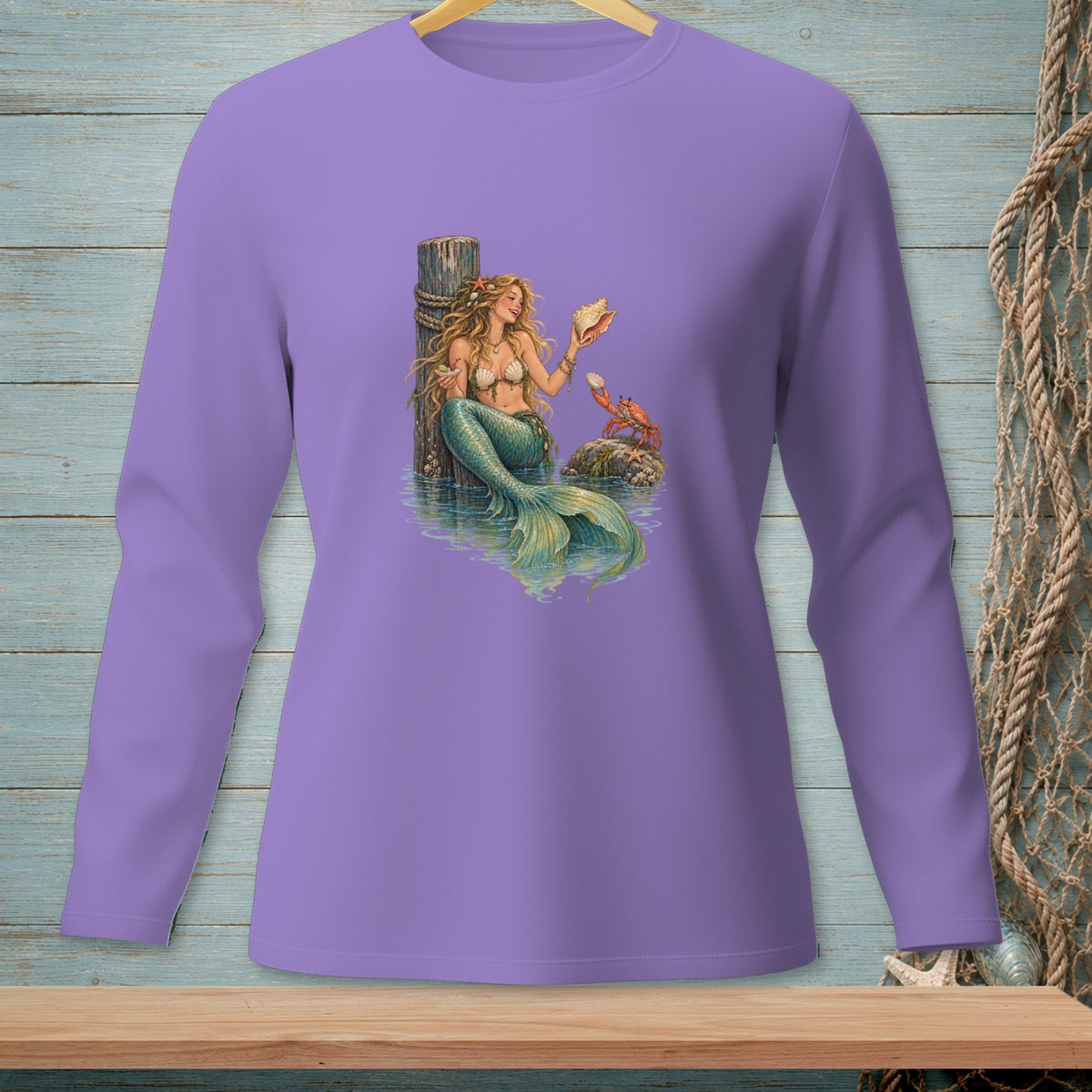 Mermaid holding seashell with crab and starfish on a wooden dock by water.