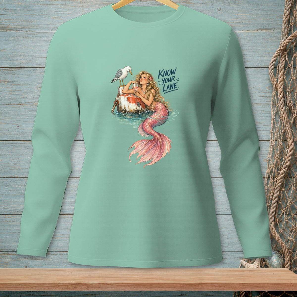Mermaid with a glass of wine and seagull on a buoy, text "Know Your Lane."
