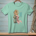 Mint t-shirt with a mermaid graphic and text that reads "Salty Hair, Don't Care."