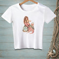 White t-shirt with a mermaid sitting on a rock with a crab and a sign reading "BLAME THE TAIL."
