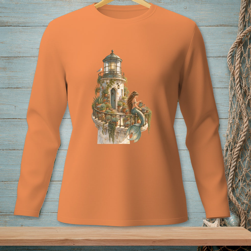 Long-sleeved orange shirt with a lighthouse, mermaid, and potted plants graphic.