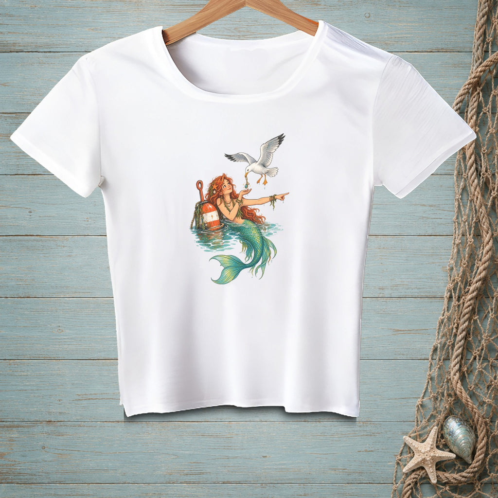 White t-shirt with a mermaid and seagull illustration.