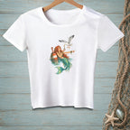 White t-shirt with a mermaid and seagull illustration.