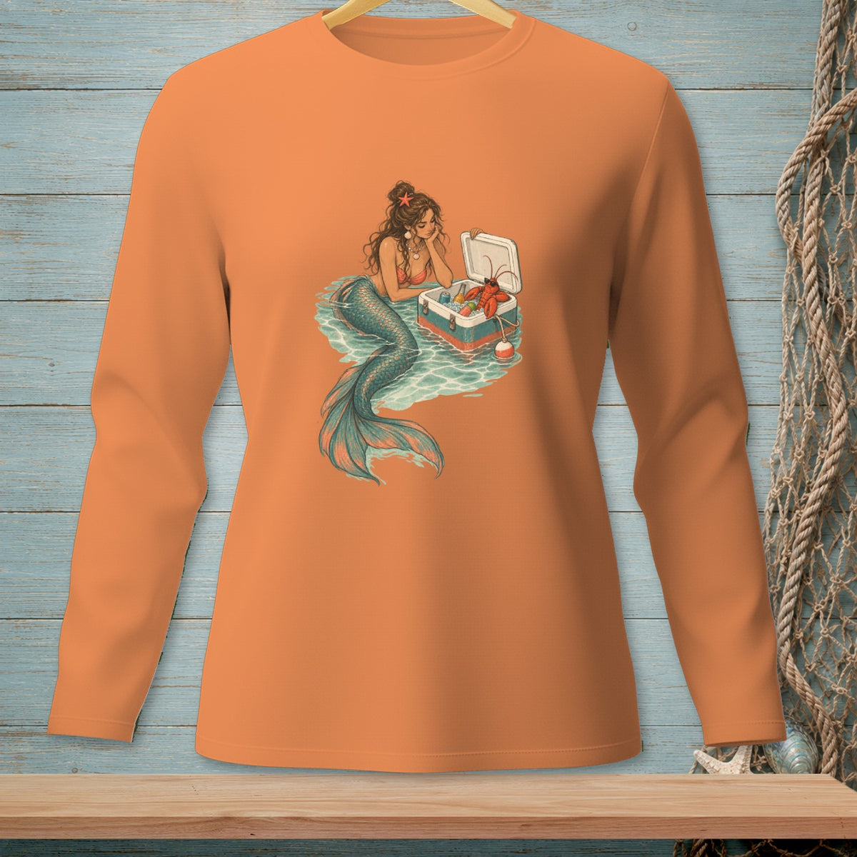 Mermaid with lobster, cooler, and drink in water scene.