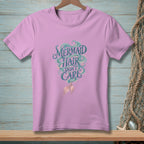 Pink t-shirt with "Mermaid Hair Don't Care" text and mermaid tail graphic.