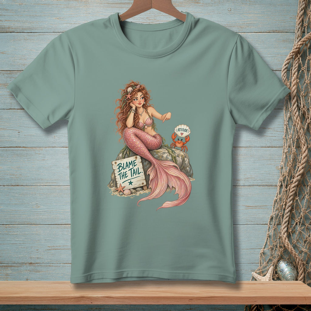 T-shirt with mermaid, crab, and "Blame the Tail" sign graphic.