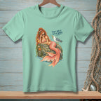 Mermaid with orange tail and sunglasses holding a drink, with text.