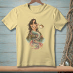 Pale yellow t-shirt with a mermaid holding a shell and a pufferfish.