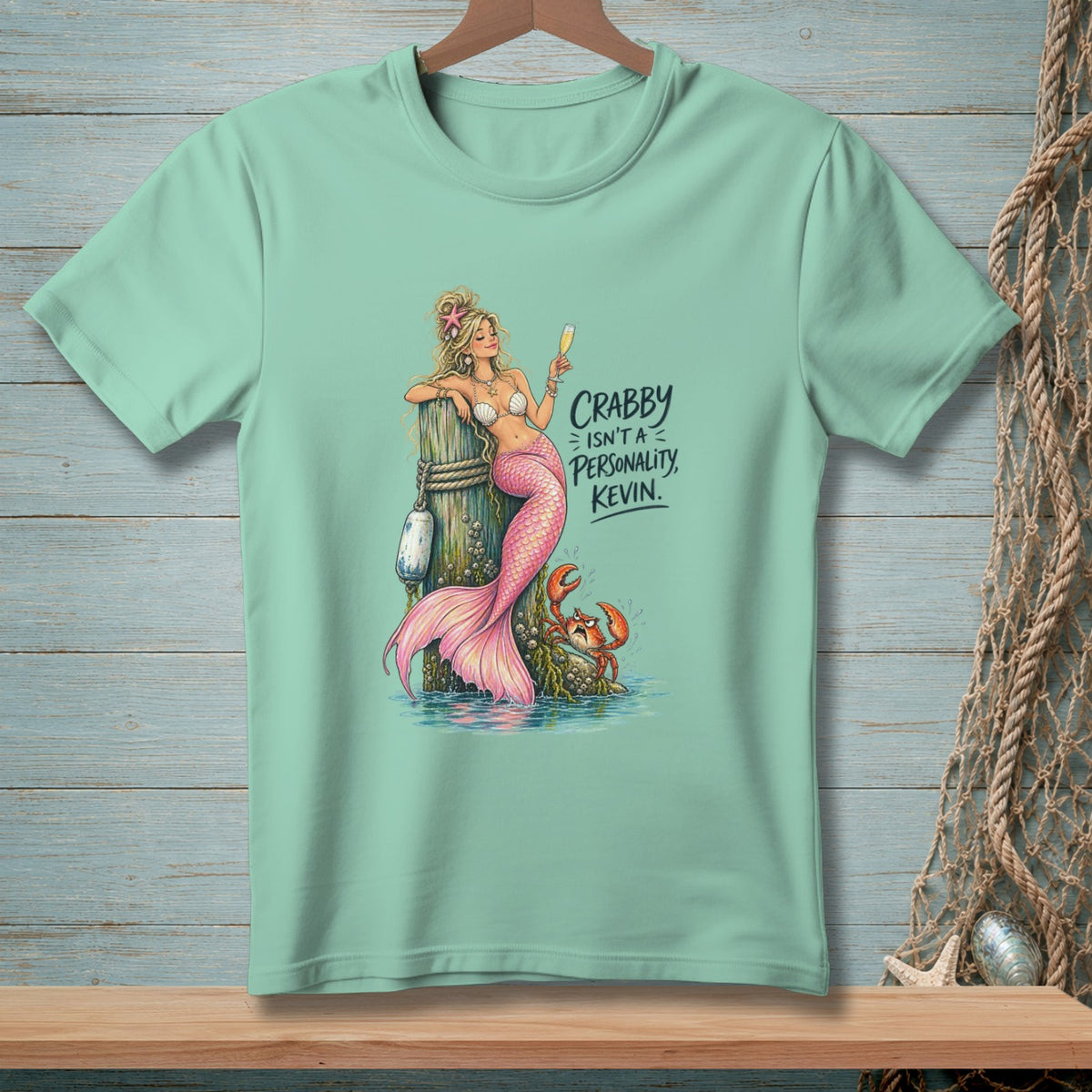 Mint green t-shirt with mermaid, crab, and text "Crabby Isn't A Personality, Kevin."