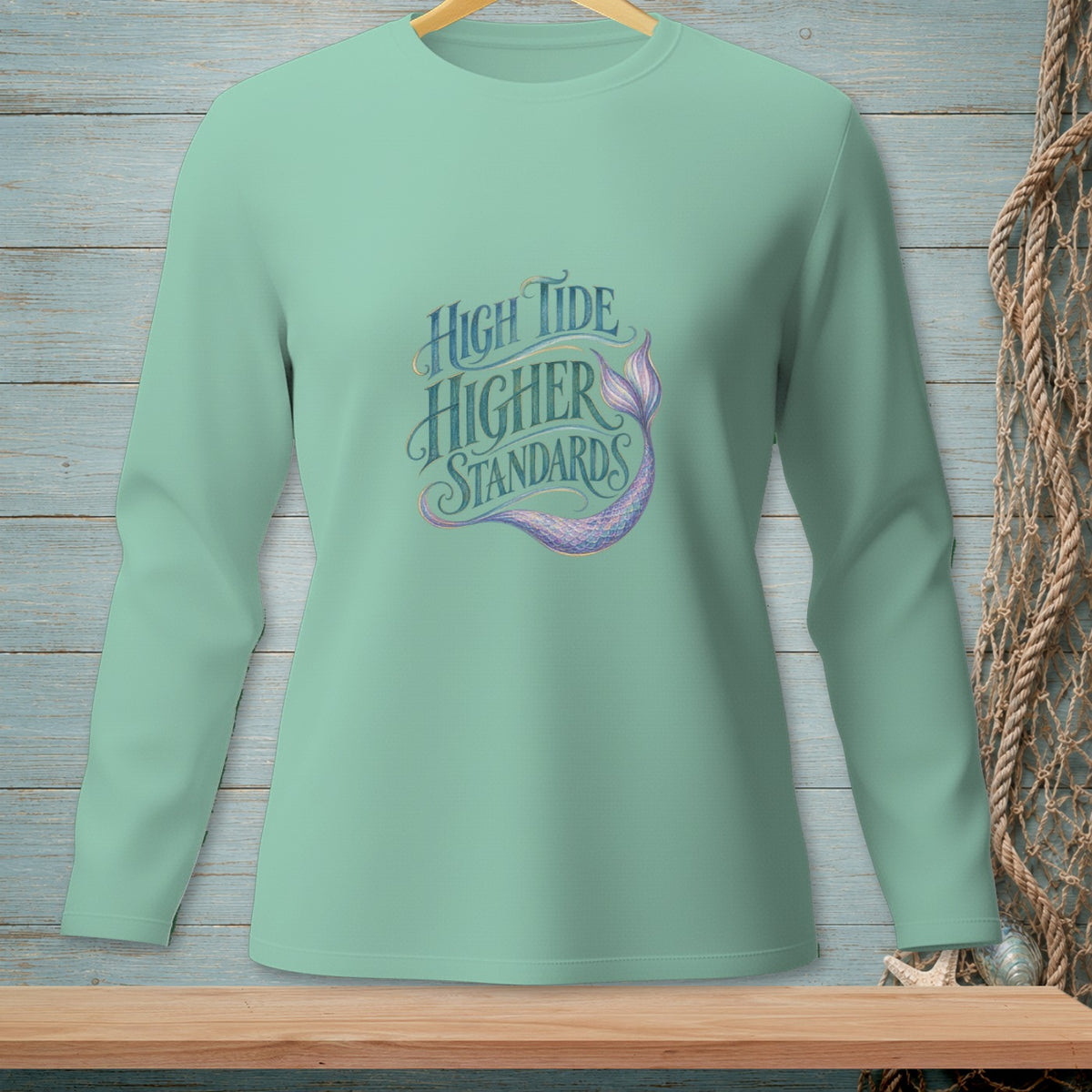 Light green long sleeve shirt with "High Tide Higher Standards" and mermaid tail graphic.