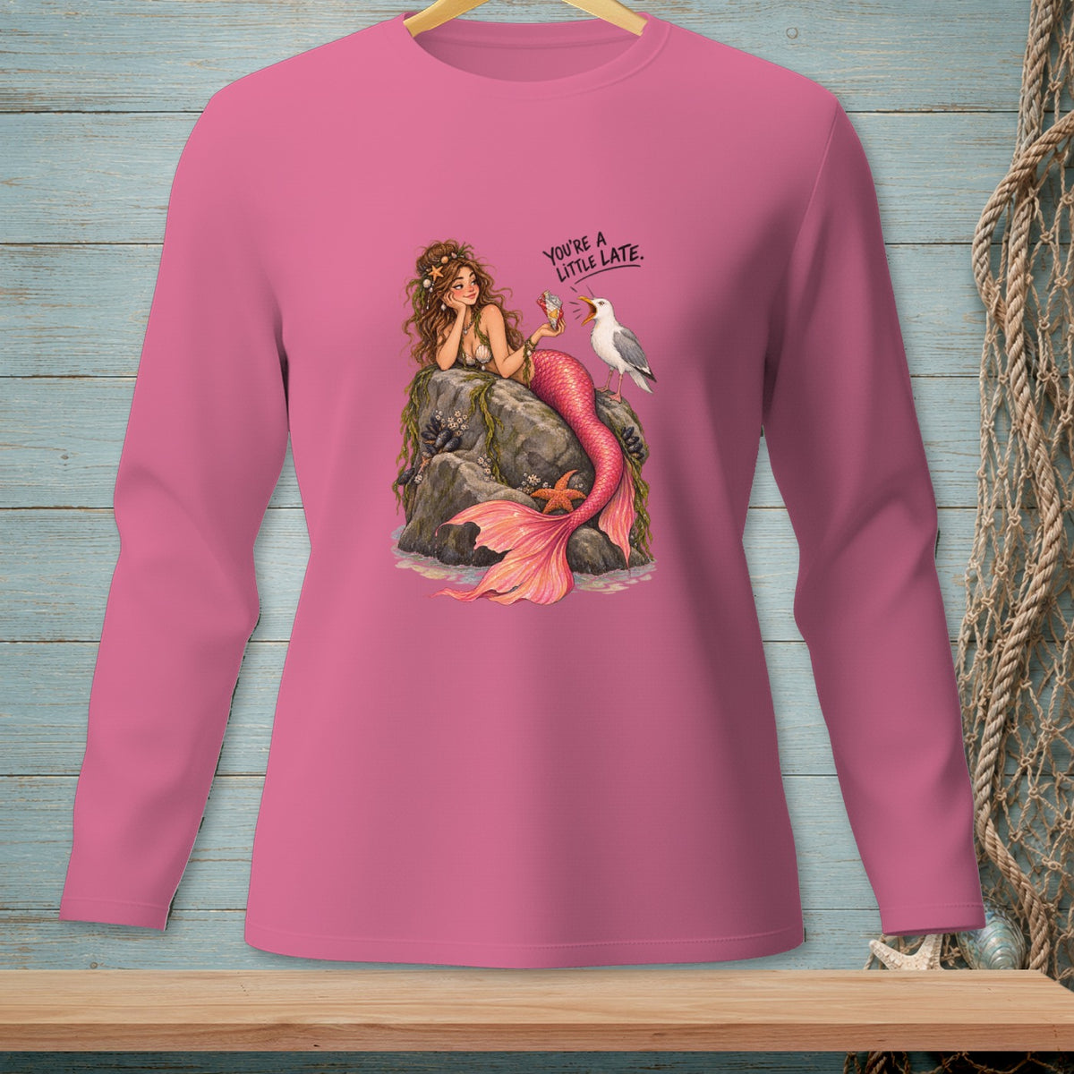 Mermaid sitting on rocks with a seagull and text "YOU'RE A LITTLE LATE."