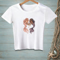 A white short-sleeve t-shirt features an illustration of two mermaids sharing a vanity table.