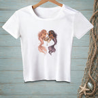 A white short-sleeve t-shirt features an illustration of two mermaids sharing a vanity table.