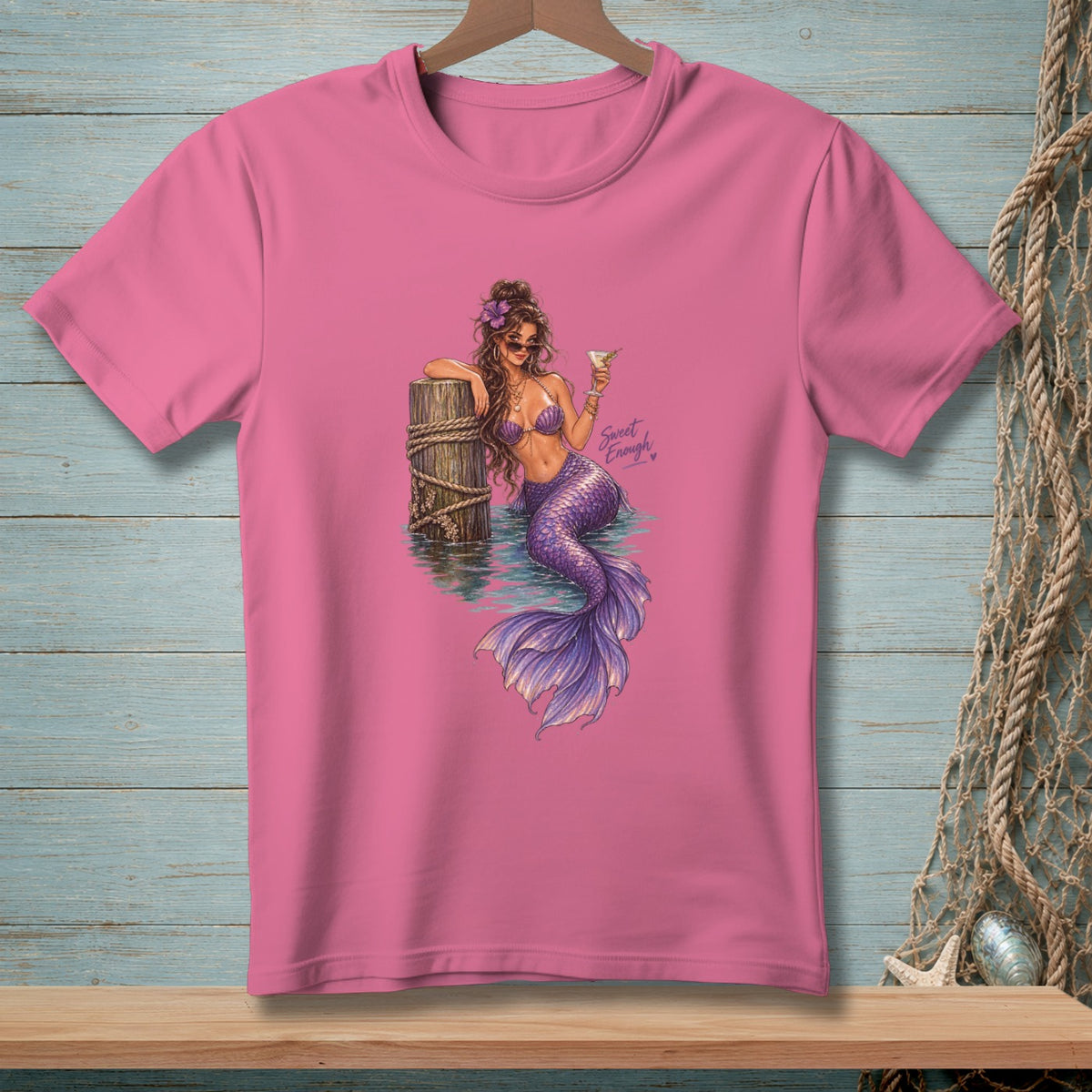 Pink t-shirt with a purple mermaid holding a cocktail, with "Sweet Enough" text.
