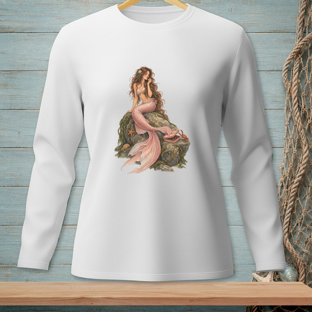 White long-sleeved shirt with a printed image of a mermaid on a rock.