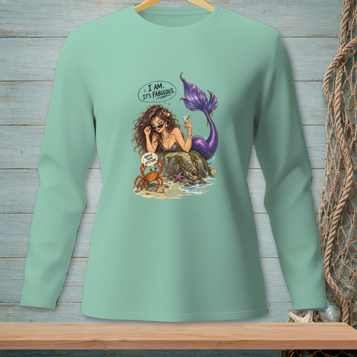 Mint long-sleeve shirt with mermaid, crab, and text "I AM. IT'S FABULOUS."