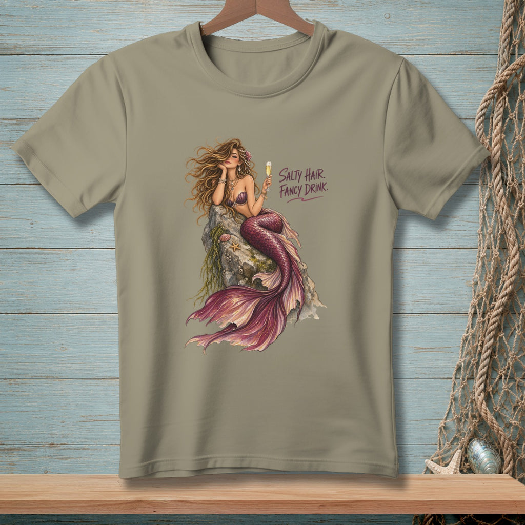T-shirt with a mermaid holding a drink, text "Salty Hair Fancy Drink."