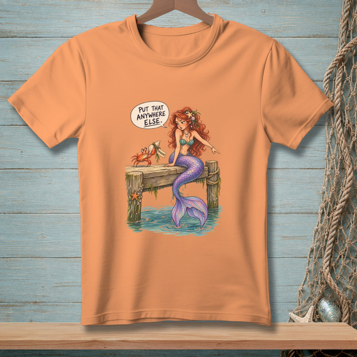 Mermaid and crab on a dock, with text "PUT THAT ANYWHERE ELSE."