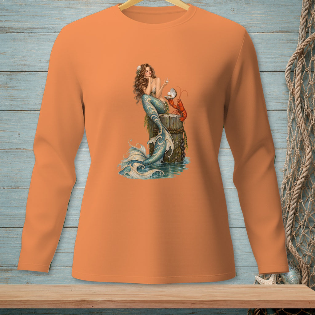 Long sleeve orange shirt with a graphic of a mermaid and lobster by the water.