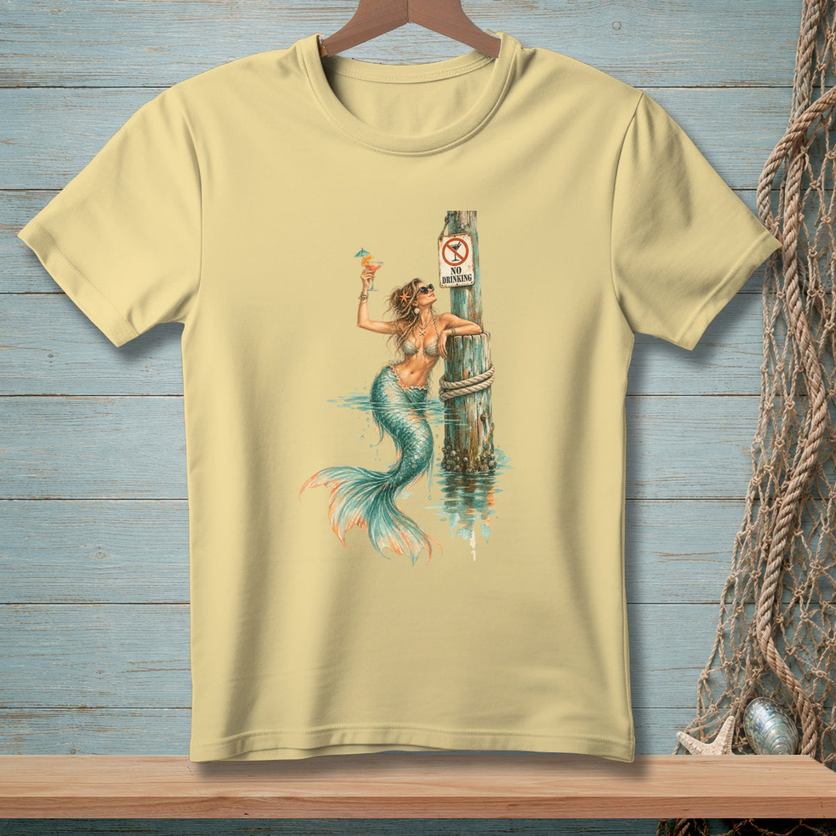 Mermaid with cocktail by a post with "No Drinking" sign.