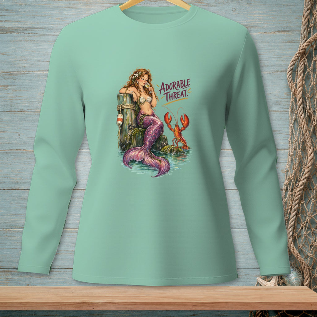 Mermaid with lobster on dock, text "ADORABLE THREAT"