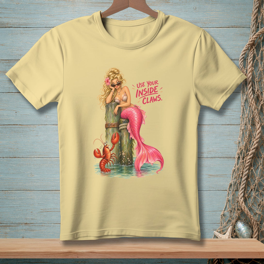 Mermaid and lobster graphic with text "USE YOUR INSIDE CLAWS" on a yellow t-shirt.