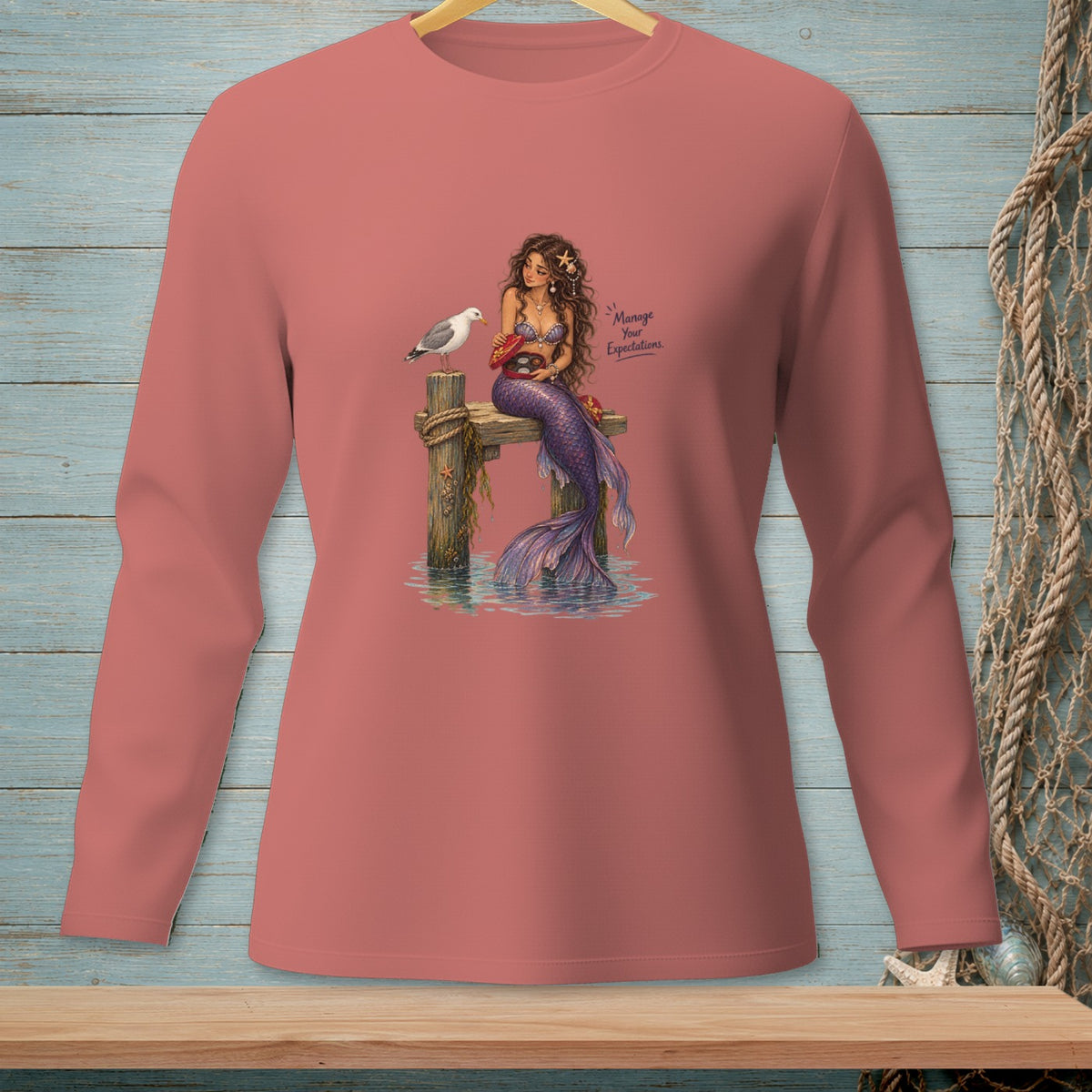 Mermaid on a dock with a seagull and the text "Manage Your Expectations."