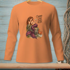 Orange long-sleeved shirt with mermaid, crab, and text "Crabby Looks Good On You".