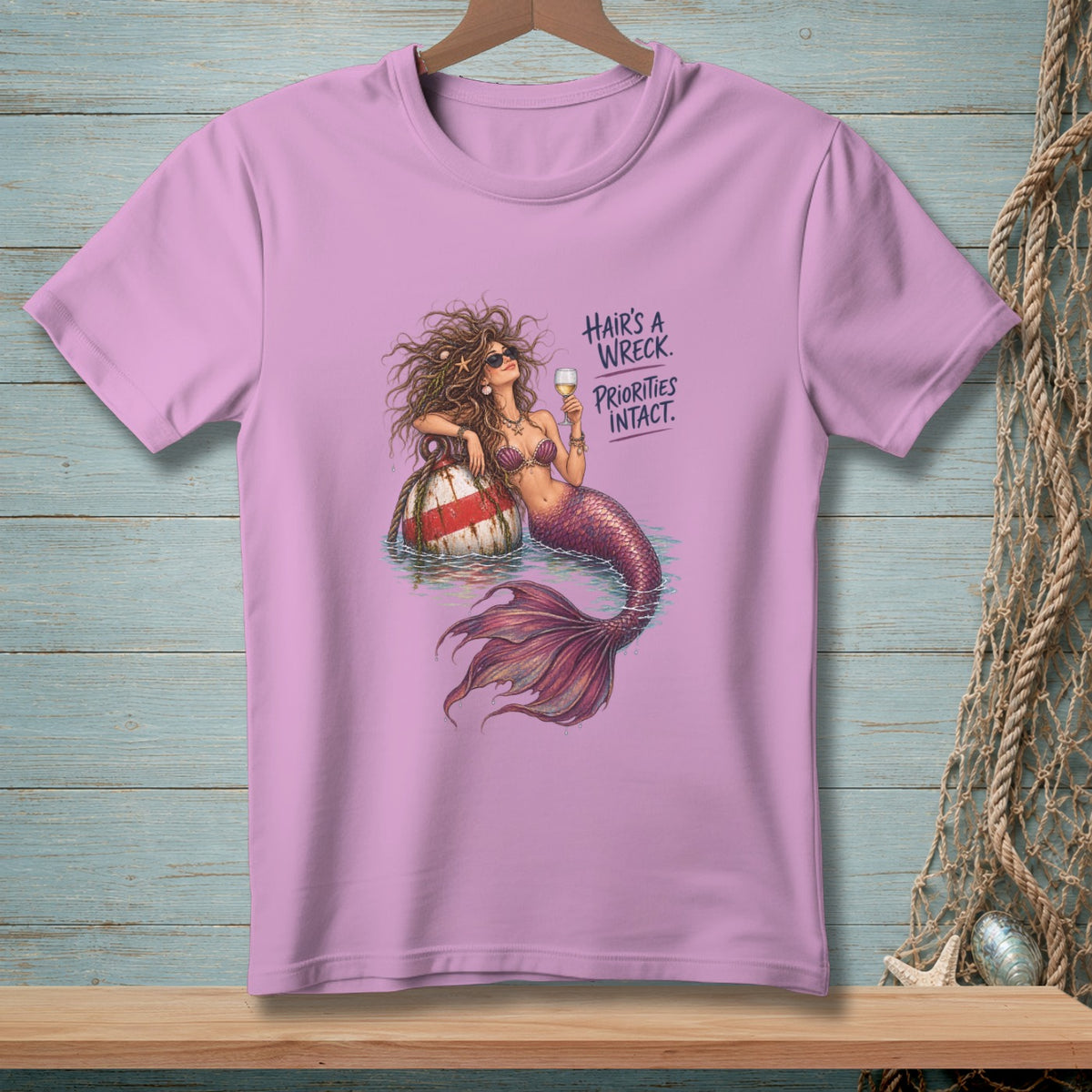 Mermaid with a glass of wine on a buoy, text "Hair's a wreck. Priorities intact."