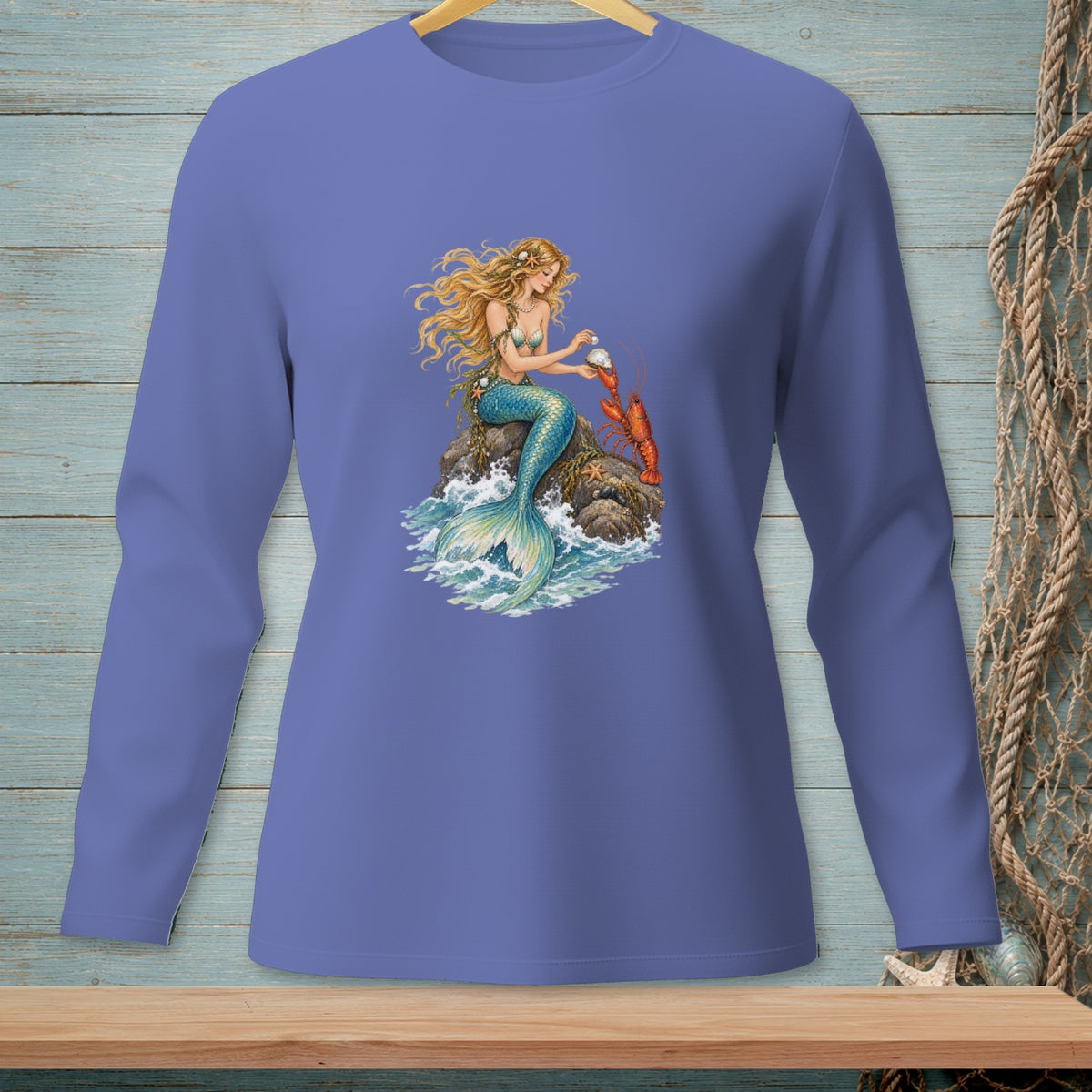 Long-sleeve shirt with a mermaid sitting on a rock with a lobster.
