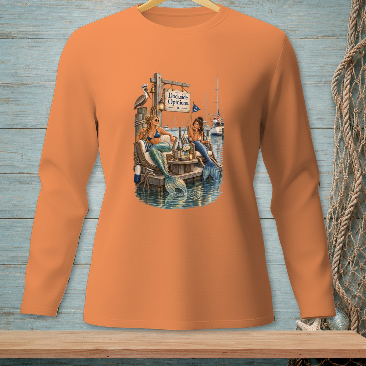 Two mermaids on a dock with "Dockside Opinions." text and a pelican.