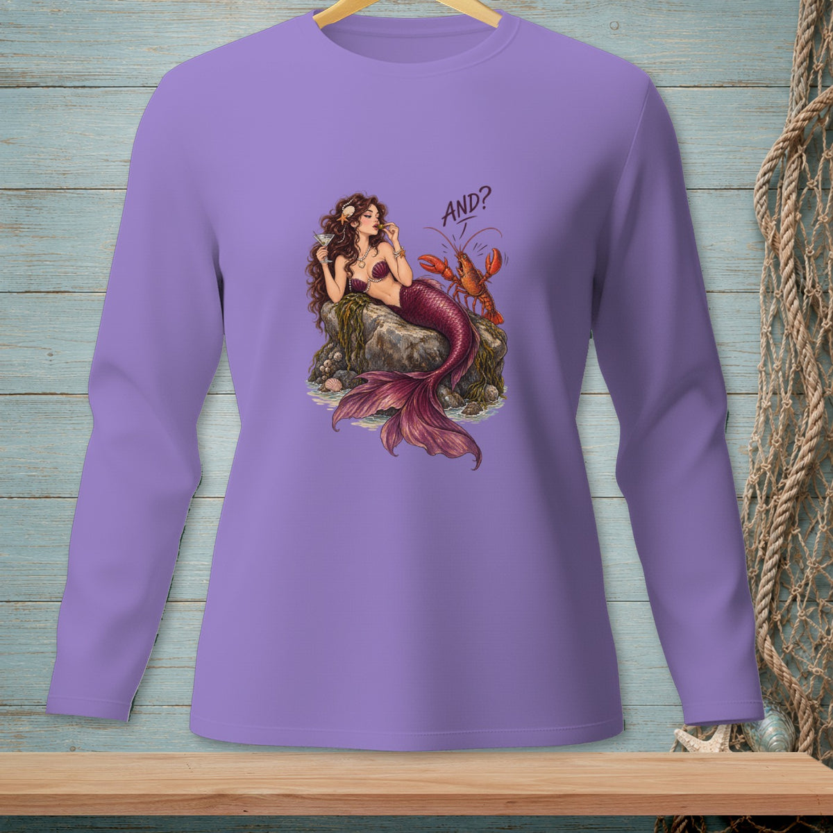 Mermaid sitting on a rock with a lobster and the text "AND?".
