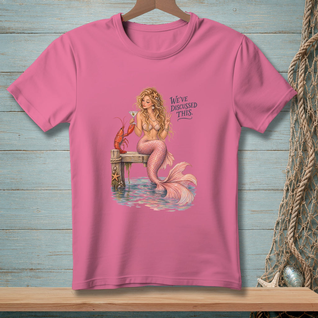 Pink t-shirt with mermaid, lobster, and text "We've discussed this."