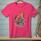 Two mermaids with blue tails are on a rock surrounded by water.