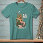 Mermaid with sunglasses and seashell bra leaning on pier post, seagull above, sign reads "Don't judge my current situation."
