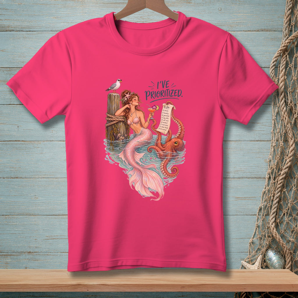 Mermaid with octopus on a pier, holding a drink and a prioritized to-do list.