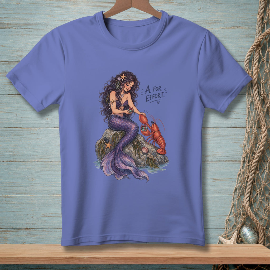 Mermaid holding a small gift for a lobster with text "A for Effort."