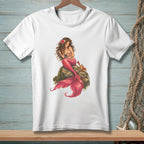 White t-shirt with a drawing of a mermaid sitting on a rock with a crab.