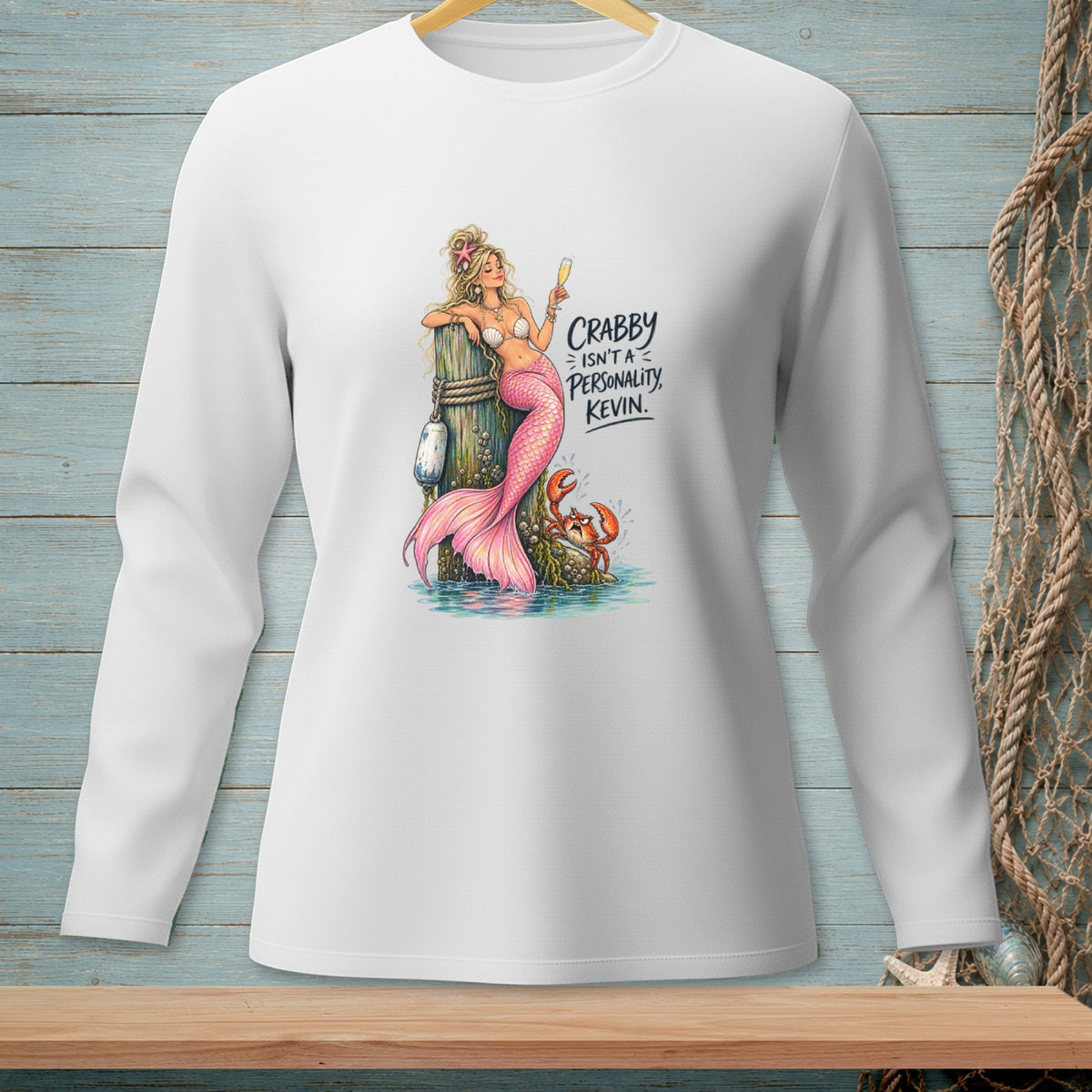 Mermaid with pink tail and champagne glass next to crab, text "CRABBY ISN'T A PERSONALITY, KEVIN."