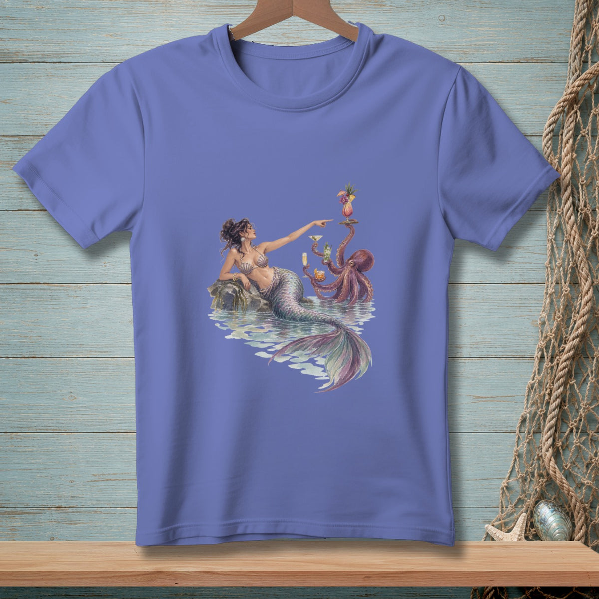 Mermaid on rock with octopus holding drinks and cocktails at water's edge.